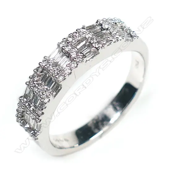 An 18ct white gold and multi diamond band ring,