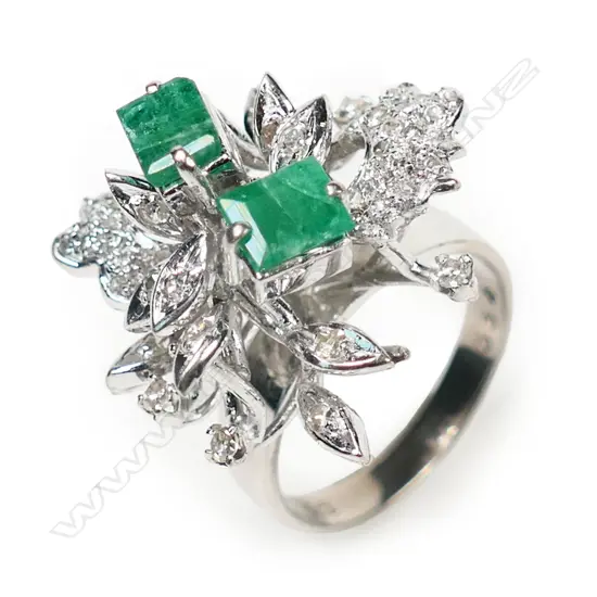A stylish 1970's 14ct white gold emerald and diamond dress ring,