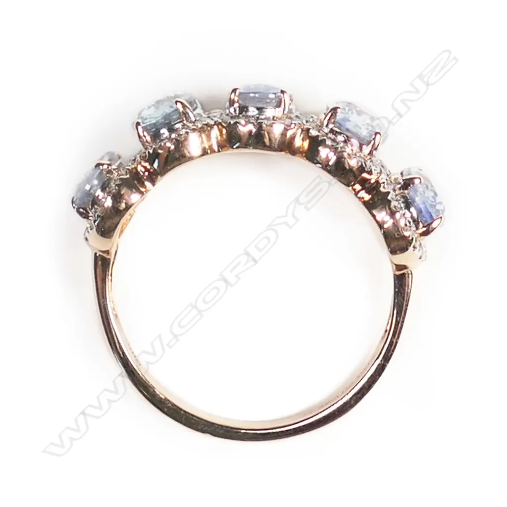A 14ct rose gold, sapphire and diamond halo ring, Image 1++