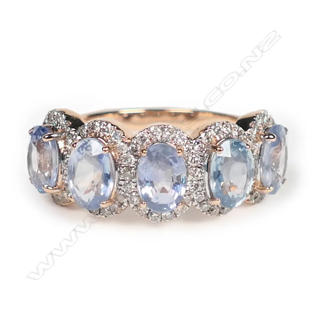 A 14ct rose gold, sapphire and diamond halo ring, Image 1++