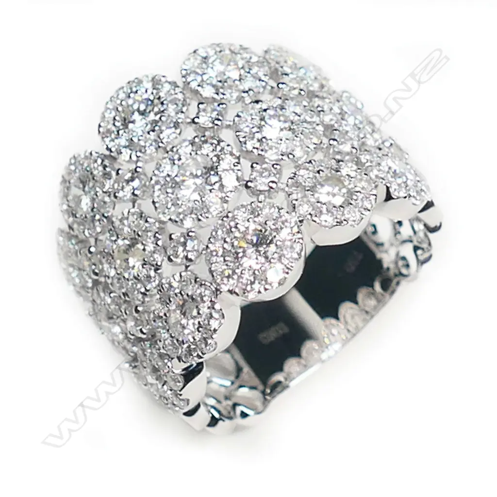 A stylish modern 18ct white gold and multi diamond dress ring, Image 1++
