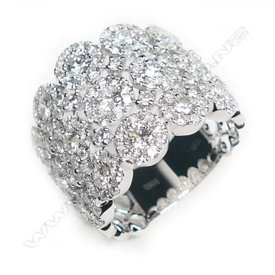 A stylish modern 18ct white gold and multi diamond dress ring,
