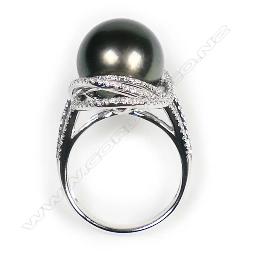 An 18ct white gold large black pearl and diamond ring, Image 1++