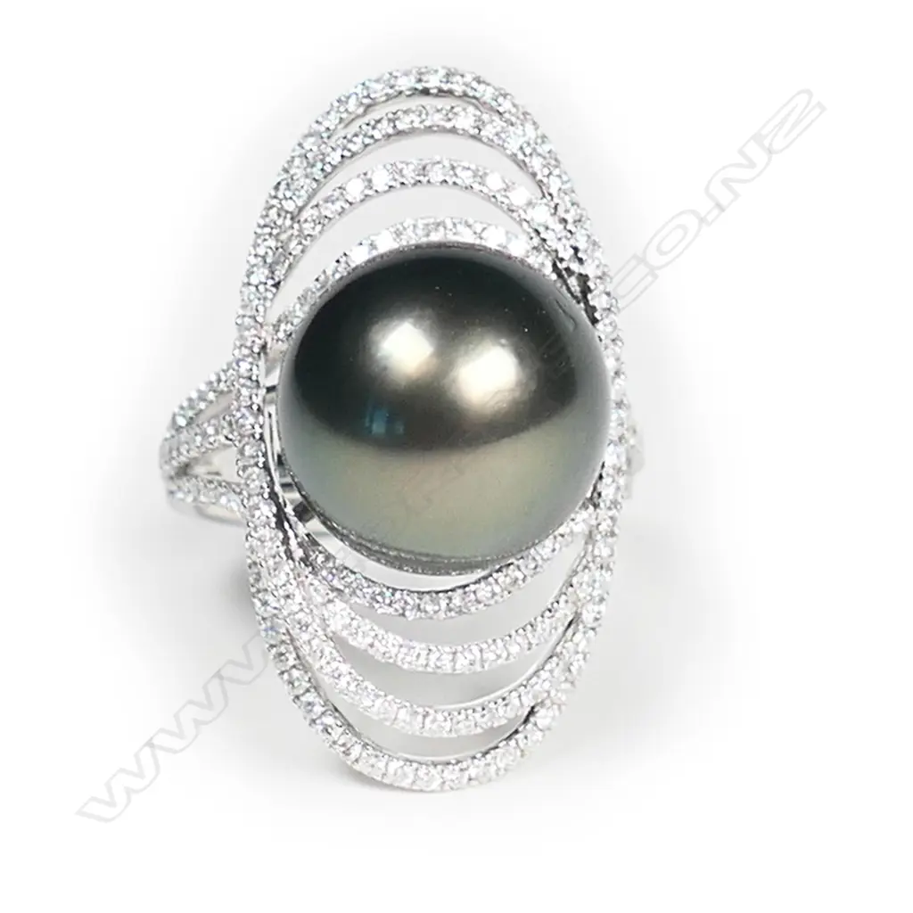 An 18ct white gold large black pearl and diamond ring, Image 1++