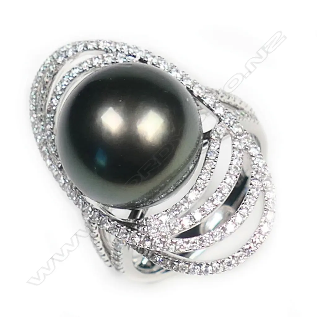 An 18ct white gold large black pearl and diamond ring, Image 1++