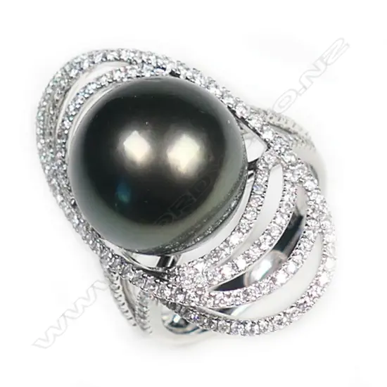 An 18ct white gold large black pearl and diamond ring,