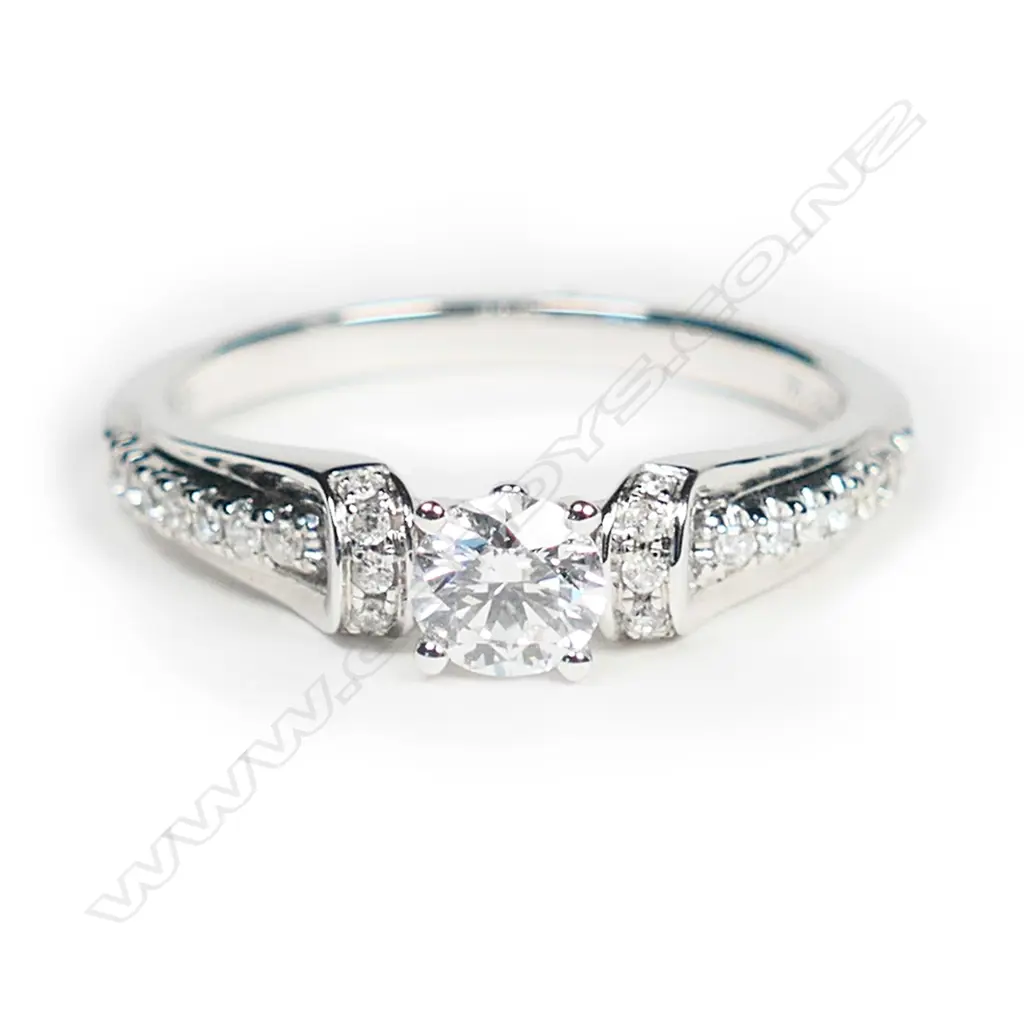 An 18ct white gold and diamond solitaire ring, Image 1++