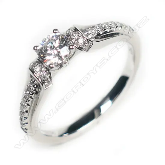 An 18ct white gold and diamond solitaire ring,