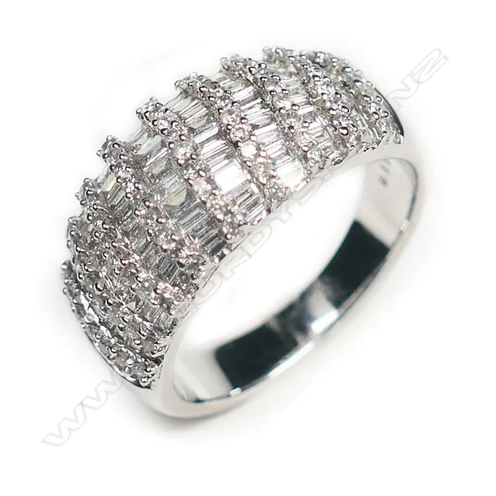An 18ct white gold and multi diamond wide band ring, Image 1++