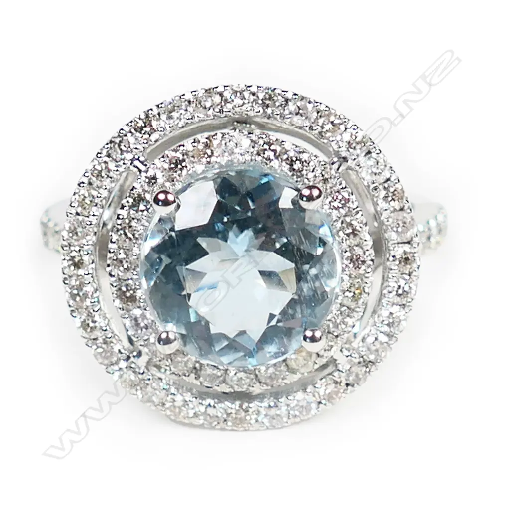 A 14ct white gold, aquamarine and diamond double halo ring, Image 1++
