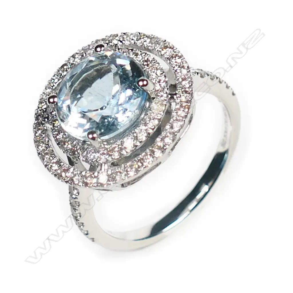 A 14ct white gold, aquamarine and diamond double halo ring, Image 1++