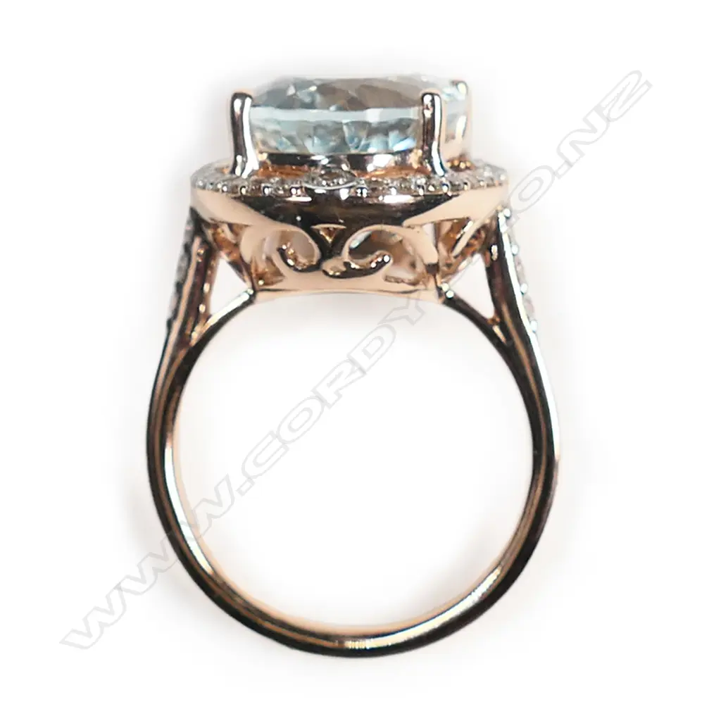 A 14ct rose gold, aquamarine and diamond vintage style halo ring, Image 1++