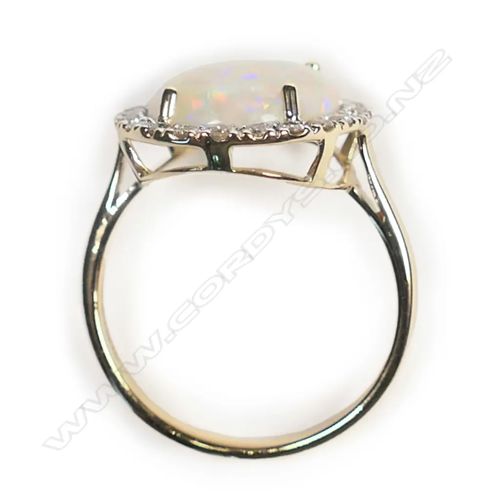 A 14ct gold, Coober Pedy opal and diamond vintage style halo ring, Image 1++