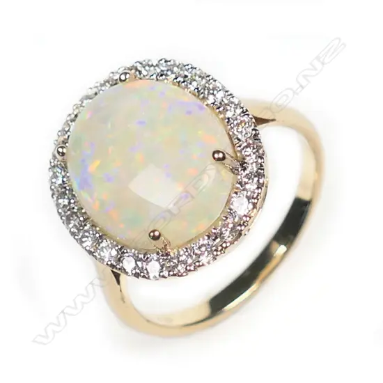 A 14ct gold, Coober Pedy opal and diamond vintage style halo ring,