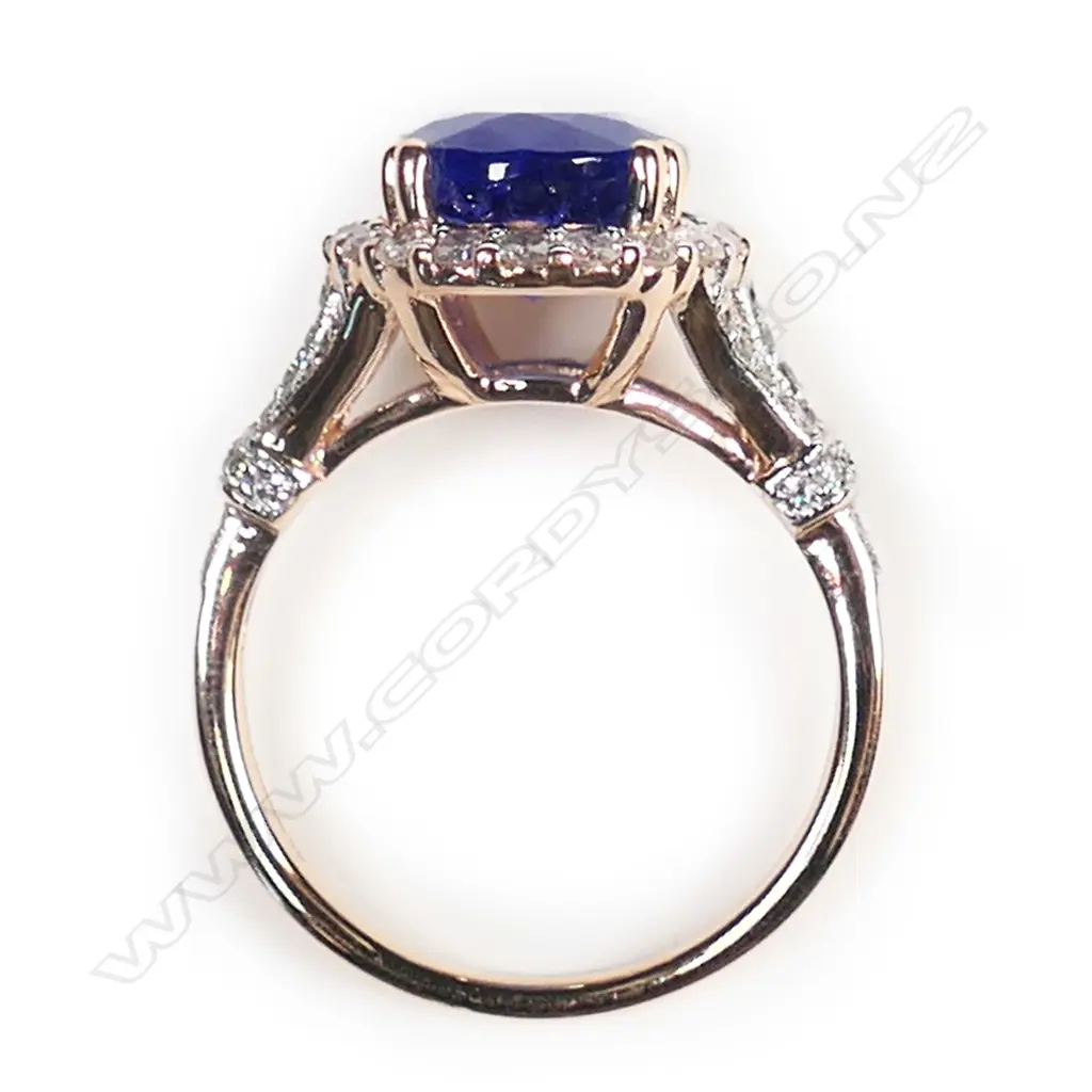 A 14ct rose gold, tanzanite and diamond vintage style halo ring, Image 1++