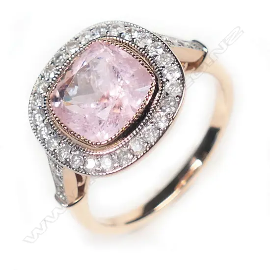 A 14ct rose gold, morganite and diamond antique style halo ring,