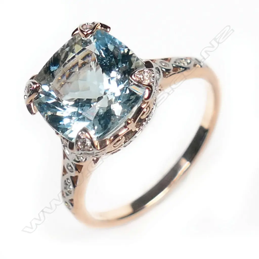 A 14ct rose gold, aquamarine and diamond dress ring, Image 1++