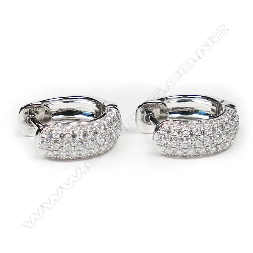 A pair of 18ct white gold and diamond huggie earrings, Image 1++