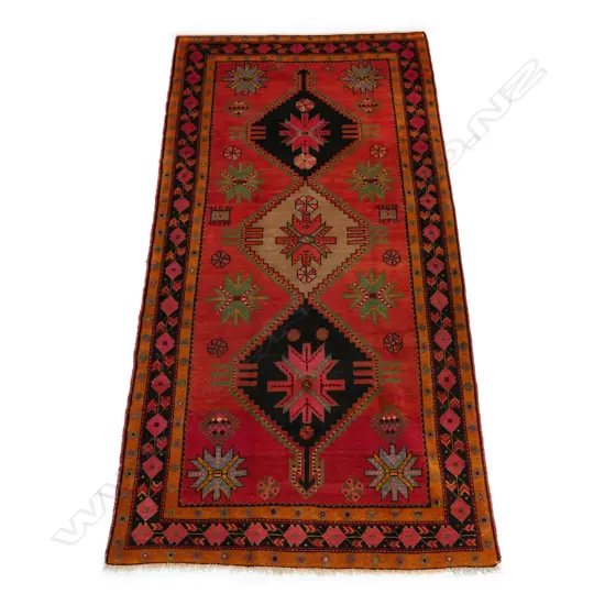 An antique hand knotted Caucasian broad runner, 280 x 143cm,