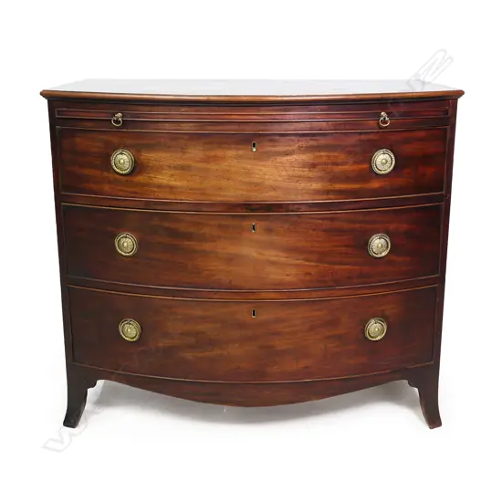 A Georgian mahogany bow front batchelor’s chest of three drawers,
