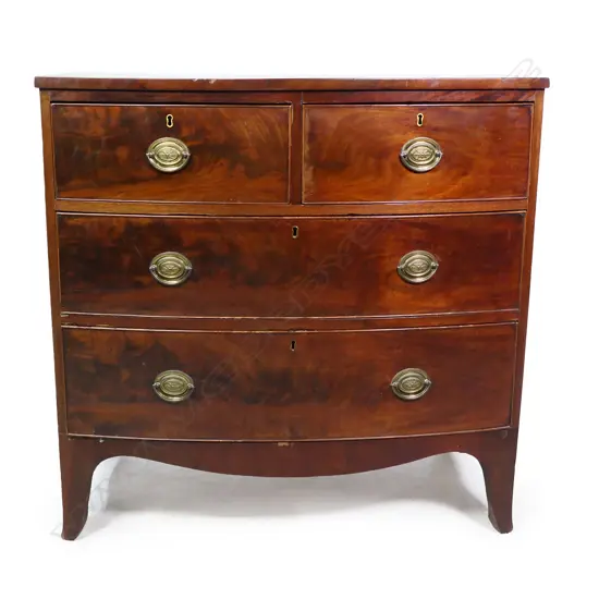 A Georgian mahogany bow front four drawer chest,