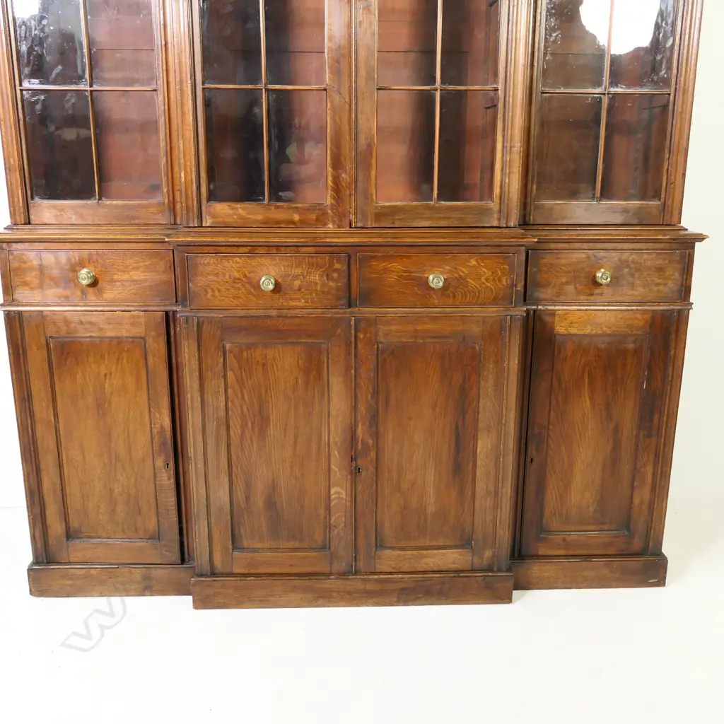 An oak breakfront bookcase cabinet, Image 1++