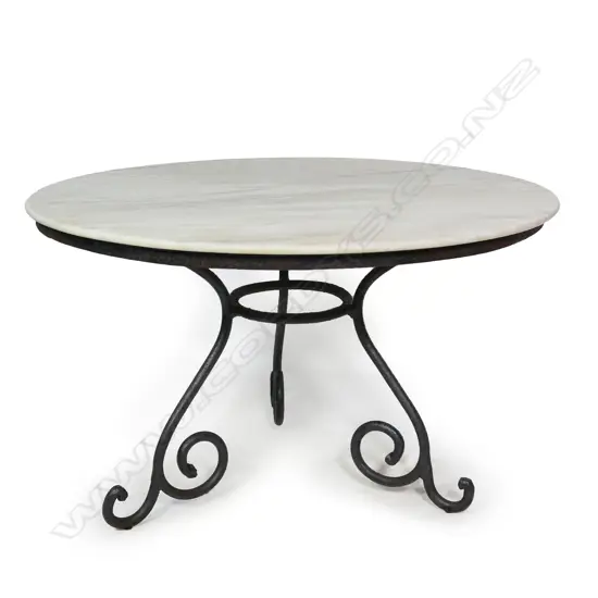 A large vintage circular white marble top table,
