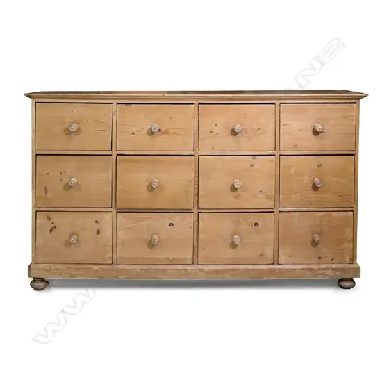 A grandly proportioned, pine multi drawer housekeeper’s chest of twelve drawers,