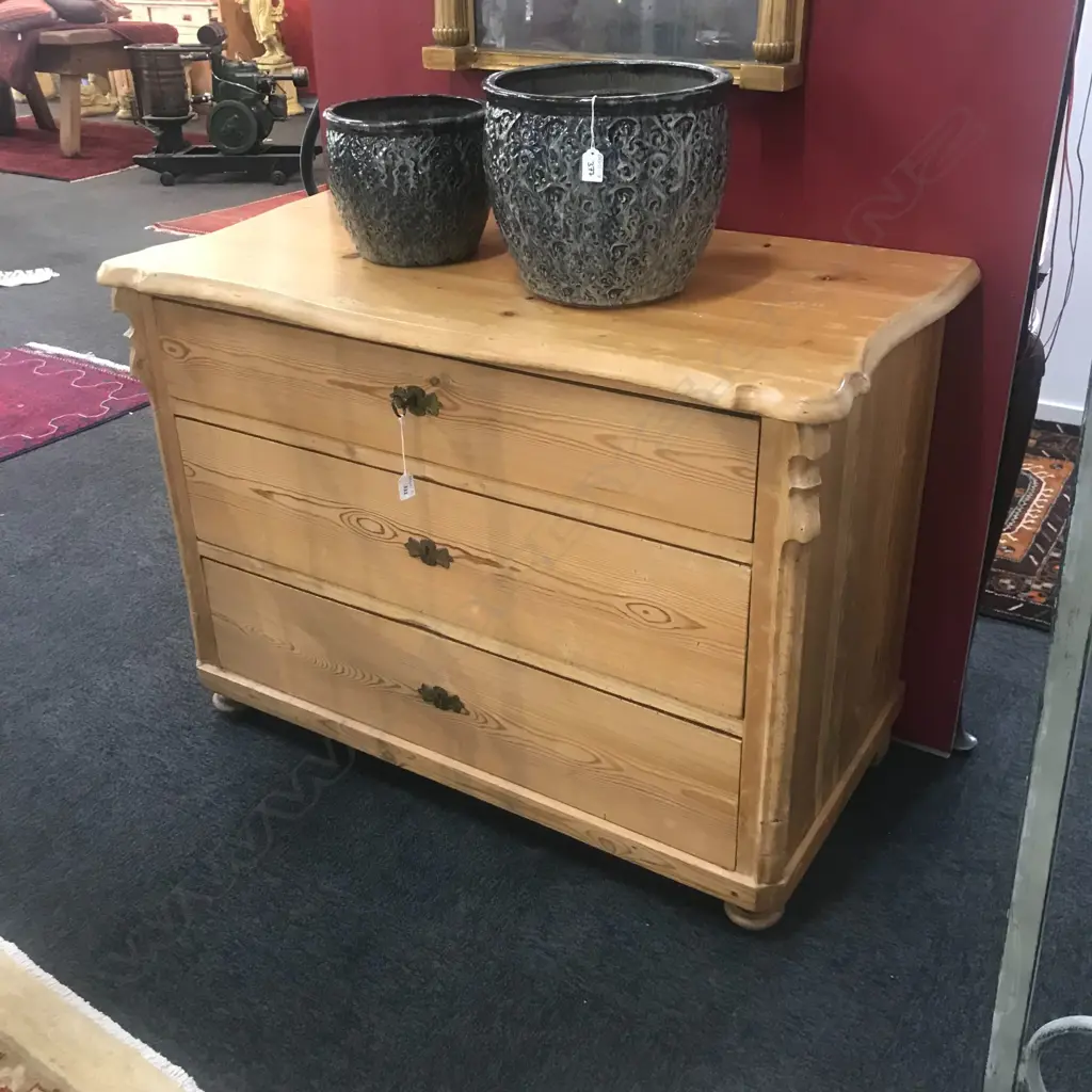 A European Biedermeier pine commode, of three graduated drawers, Image 1++