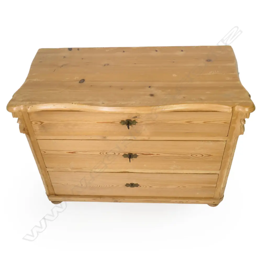 A European Biedermeier pine commode, of three graduated drawers, Image 1++