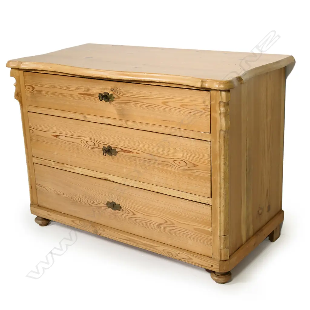 A European Biedermeier pine commode, of three graduated drawers, Image 1++
