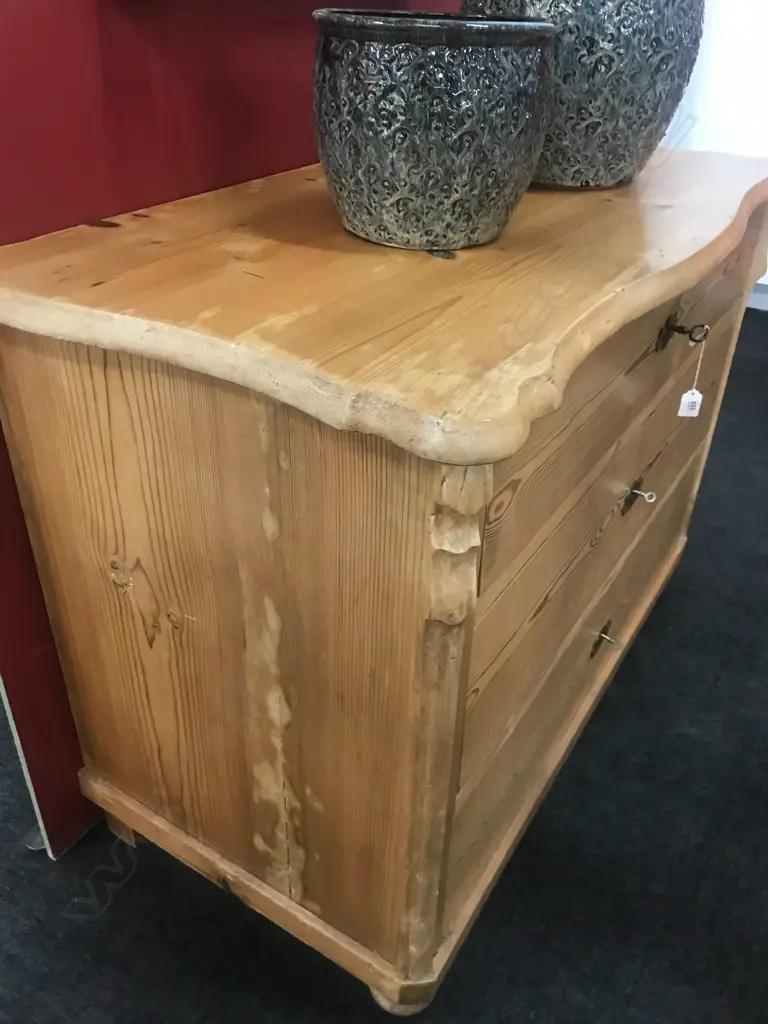 A European Biedermeier pine commode, of three graduated drawers, Image 1++