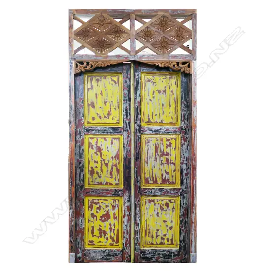 A large pair of vintage Indonesian hardwood entrance doors in frame