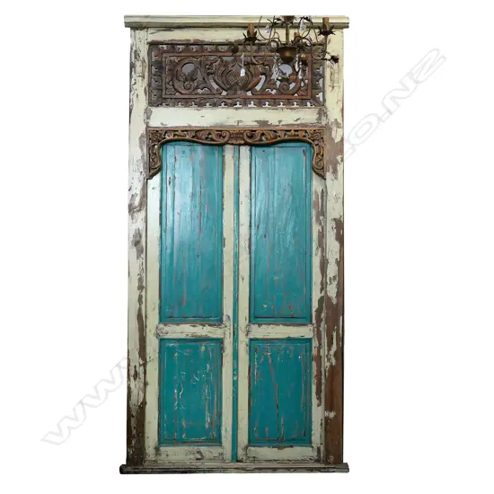 A large pair of vintage Indonesian hardwood entrance doors in frame