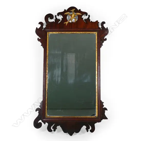 A George III period, mahogany and parcel gilt, fretwork framed wall mirror.