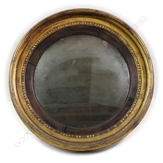 A Georgian period bulls-eye mirror, with original convex plate,