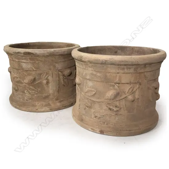 A pair of large French style terracotta citrus planters,