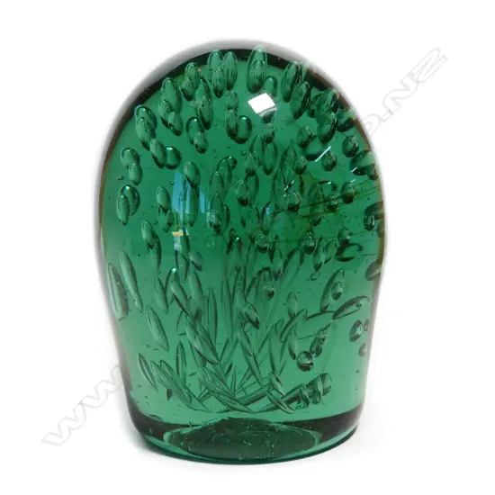 A Victorian green glass 'dump' paperweight,
