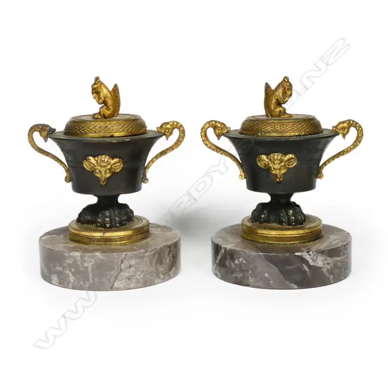 A pair of French Empire small bronze and ormolu censors,