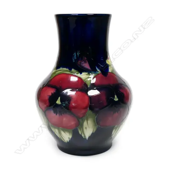 A William Moorcroft baluster pansy vase,