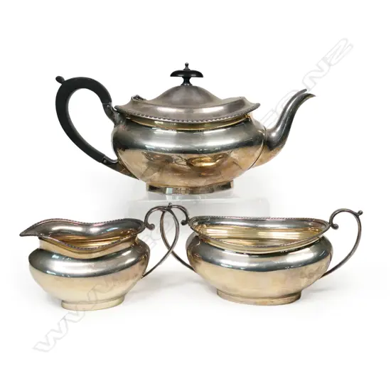 A silver three-piece tea set,