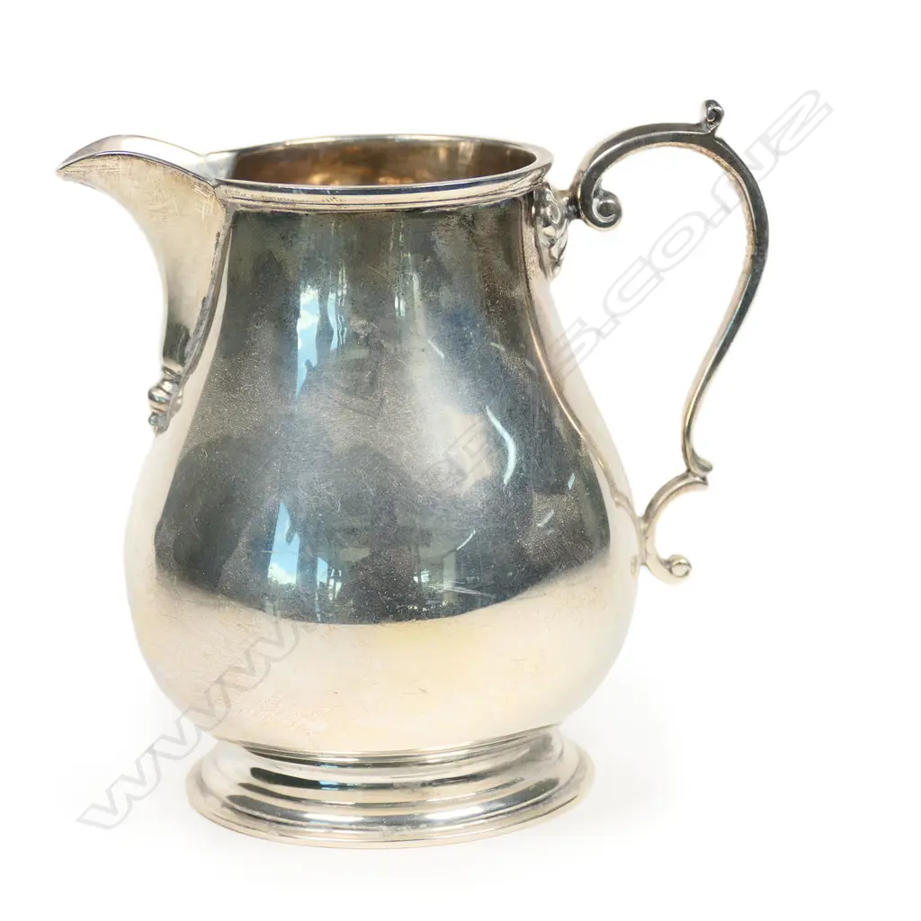 A silver cream jug with a rare assay mark, Image 1++