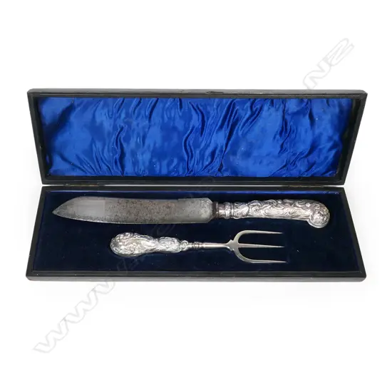An Edwardian Art Nouveau silver handled cake knife and fork,