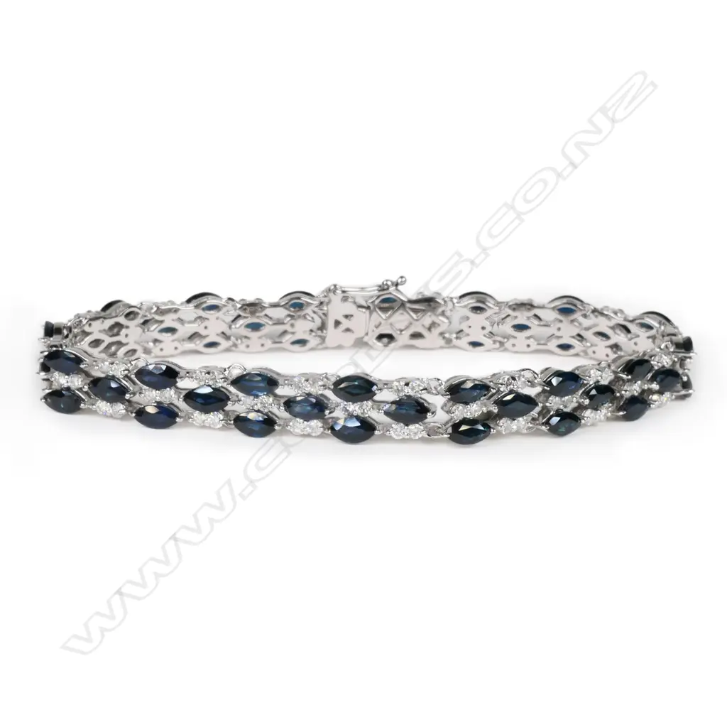 A 14ct white gold, sapphire and diamond triple line bracelet, Image 1++