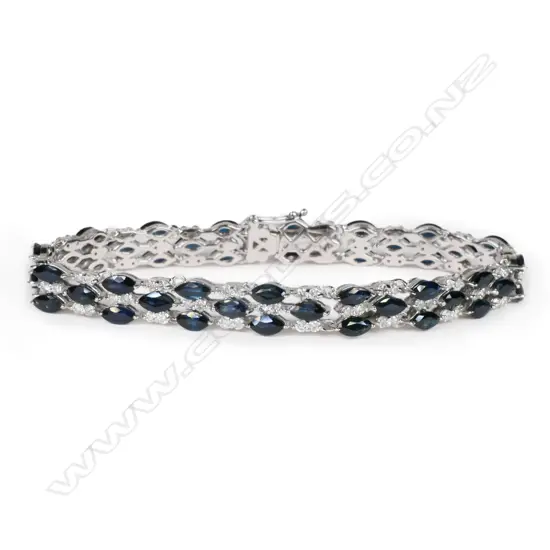 A 14ct white gold, sapphire and diamond triple line bracelet,