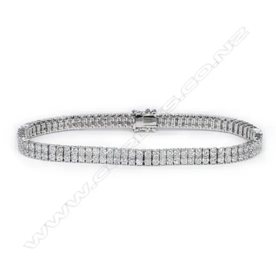 An 18ct white gold and diamond tennis bracelet,