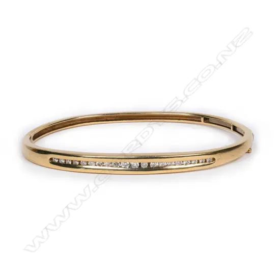 A 9ct gold and diamond hinged bangle,