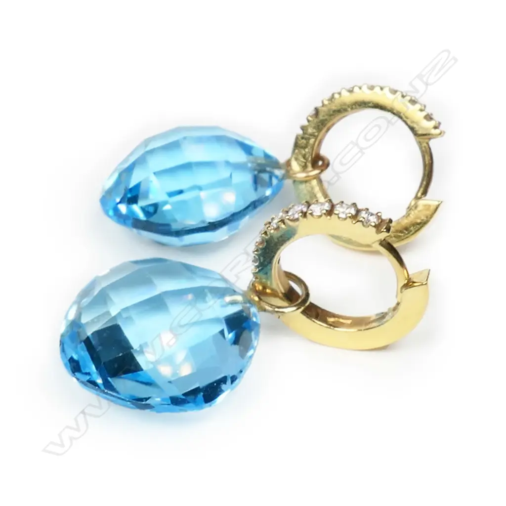 A pair of 18ct gold, diamond and blue topaz earrings, Image 1++