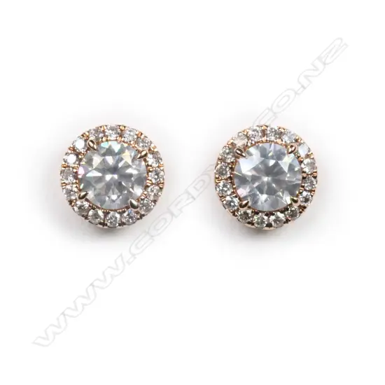 A pair of 14ct rose gold and diamond halo stud earrings,