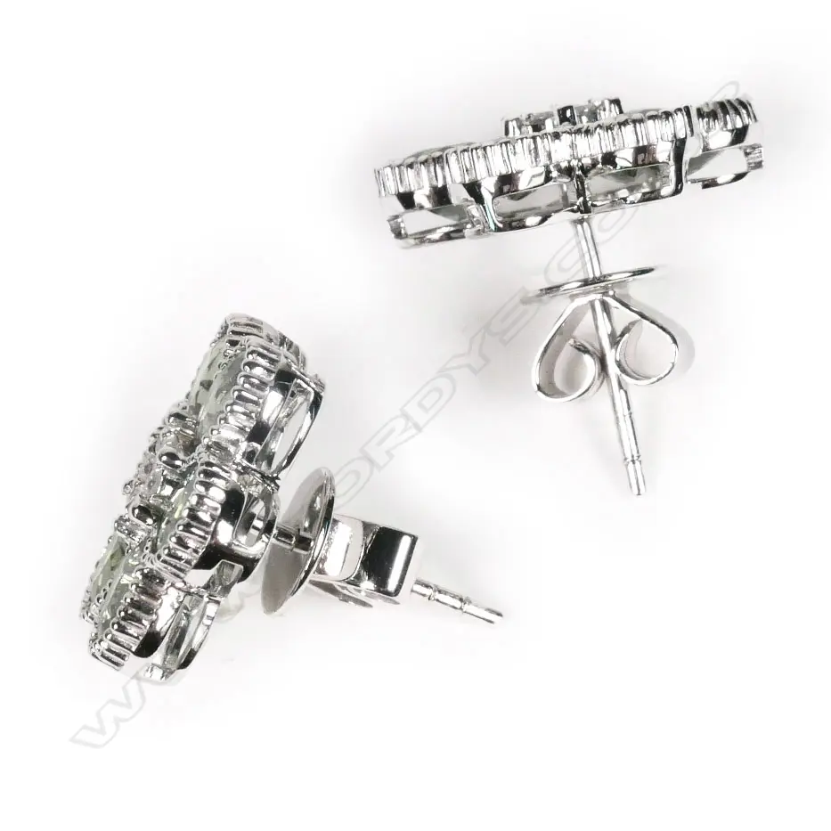 A 14ct white gold, green Ceylon sapphire and diamond flower design stud earrings, Image 1++